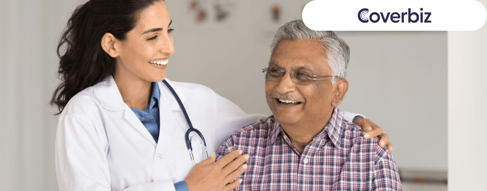 a lady doctor smiling with a veteran Indian man 