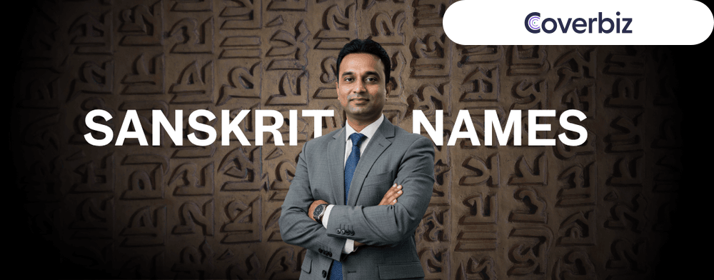 A businessman with a grey suit and a blue tie standing arms crossed, with Sanskrit Names written on his background. The background is a overlay of Sanskrit letters
