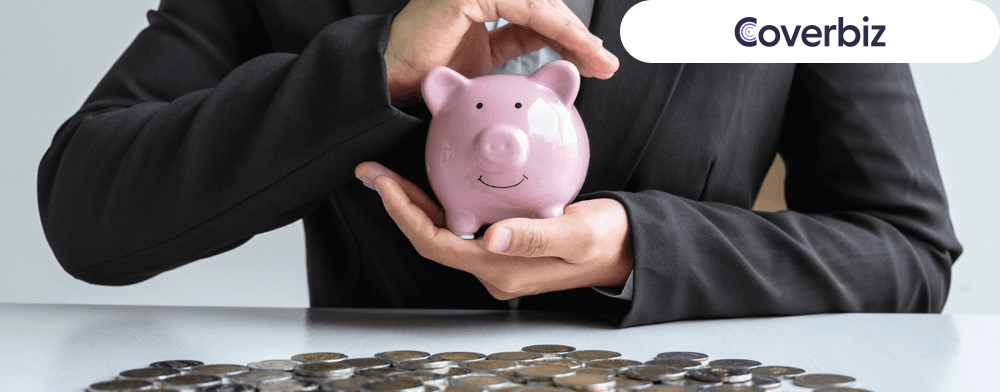 A person holding gratuity money in a piggy bank