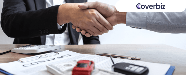 two people shaking hands of each other, a paper and a white calculator lying below