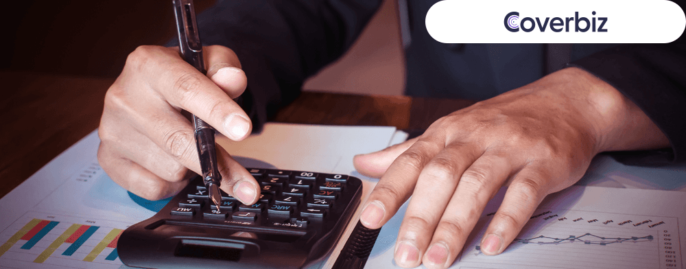 A person calculating the difference between operating profit and net profit
