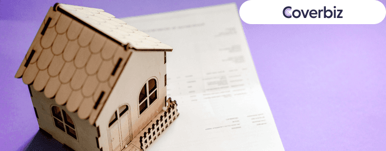 A miniature house with few keys and an application form for house rent allowance under it